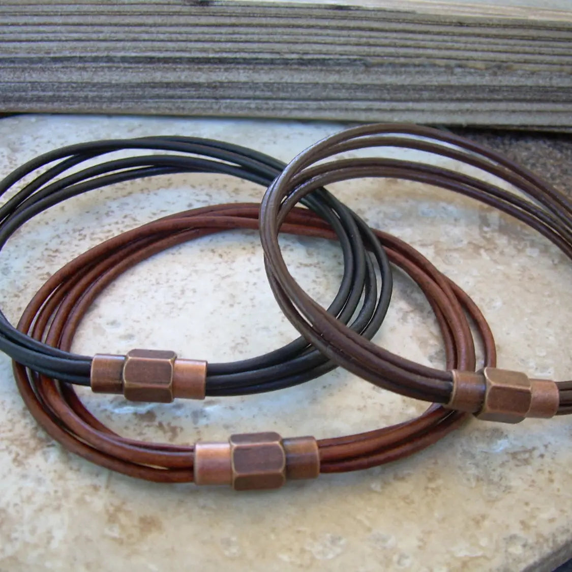 Thin strand bracelet with copper toned brass magnetic clasp